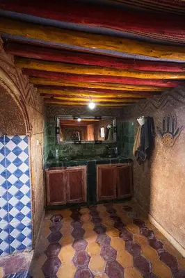 a kitchen with a counter and a sink in a room at Desert Camp Laila in Mhamid