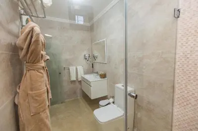 a bathroom with a shower and a toilet and a sink at Riad Sebti Fès in Fès