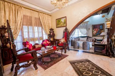 a living room with a couch and a table at Riad Sebti Fès in Fès