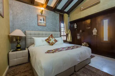 a bedroom with a large bed in a room at Riad Sebti Fès in Fès