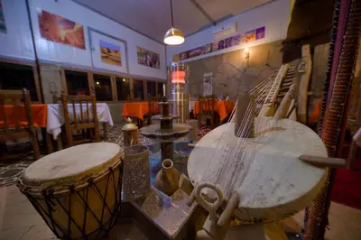 a room with a table and a drum in a room at Tin Joseph in Ouarzazate