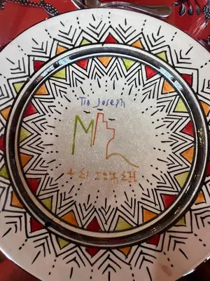 a mirror with the words the queen of hermeticism at Tin Joseph in Ouarzazate