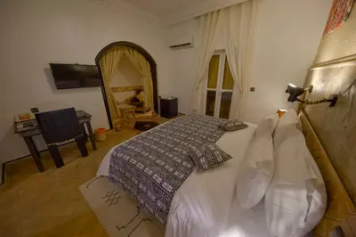 a bedroom with a large bed in a room at Tin Joseph in Ouarzazate
