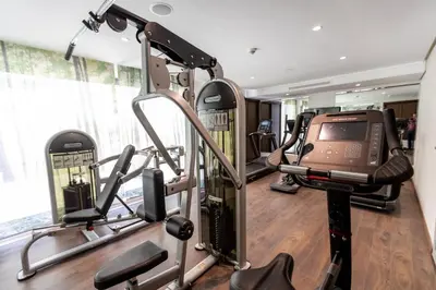 a gym with several treadmills and a treadmill at Nour Plazza Hotel in Fès
