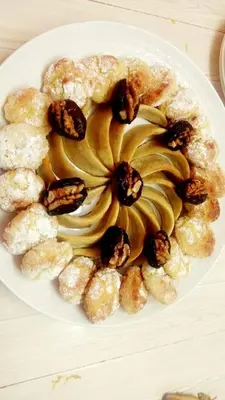 a white plate of food on a table at Maison d'hôtes Jnan Atlas in Sidi Abdalwahad