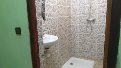 a bathroom with a sink and a toilet at Merzouga Quiet apart &camels trecking in Merzouga