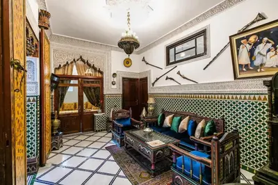 a living room with a couch and a table at Spacious Apartment in Fès with Private Pool, 150 sqm in Fès
