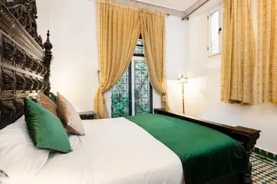 a bedroom with a large bed and a window at Spacious Apartment in Fès with Private Pool, 150 sqm in Fès