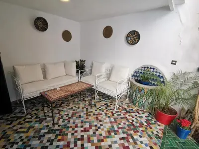 a living room with two couches and a table at Spacious Apartment in Fès with Private Pool, 150 sqm in Fès