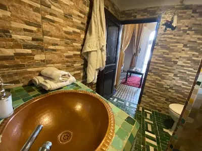 a bathroom with a copper sink in a room at Charming Apartment in Fès - 30 m² + View in Fès