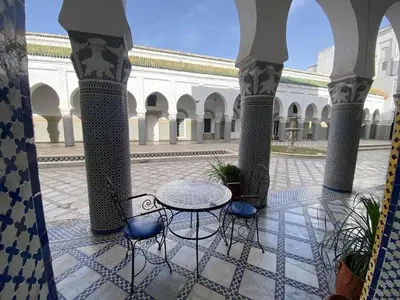 a patio with a table and chairs in a courtyard at Charming Apartment in Fès - 30 m² + View in Fès