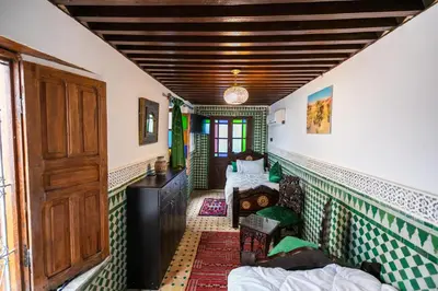 a room with green and white tile on the walls at Palais Riad Chahd Luxury in Fès