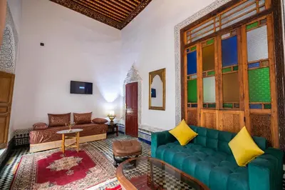 a living room with a couch and a table at Palais Riad Chahd Luxury in Fès
