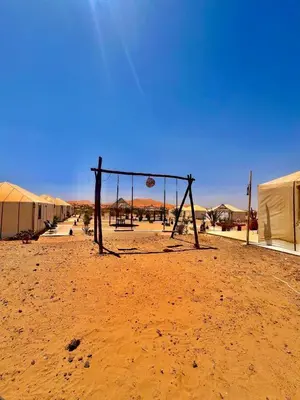 a basketball hoop in the middle of the desert at Amskou Camp in Merzouga