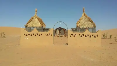 a building in the middle of the desert at RestCamp ErgChebbi in Merzouga