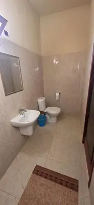 a bathroom with a sink and a toilet at Chez Brahim vue panoramique in Aït Ben Haddou
