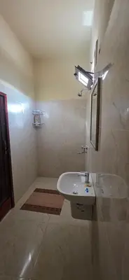 a bathroom with a sink and a mirror at Chez Brahim vue panoramique in Aït Ben Haddou