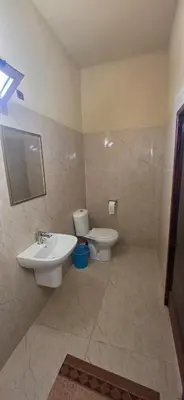 a bathroom with a sink and a toilet at Chez Brahim vue panoramique in Aït Ben Haddou