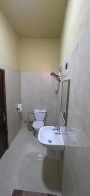 a bathroom with a sink and a toilet at Chez Brahim vue panoramique in Aït Ben Haddou