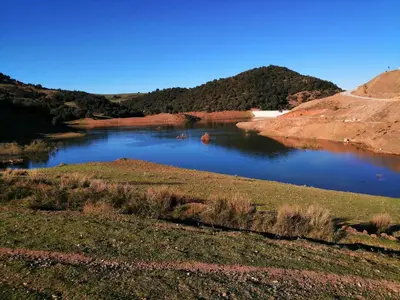 a river in the middle of a field at Tamanoucht in Ifrane