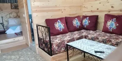 a living room with a couch and a table at Tamanoucht in Ifrane