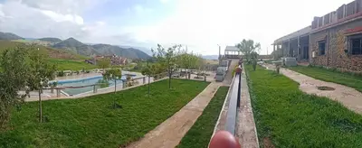 a view of a train track with a river at Tamanoucht in Ifrane