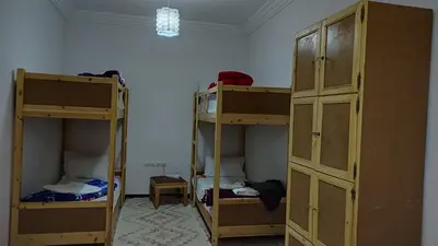 two sets of bunk beds in a room at Afgo Hostel in Ouarzazate
