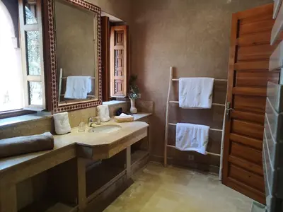 a bathroom with a sink and a mirror at Domaine Casa Cecilia in Marrakech