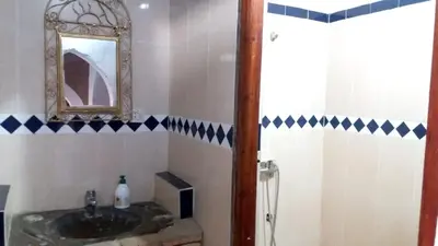 a bathroom with a sink and a mirror at Spacious House in Hassilabied in Hassilabied