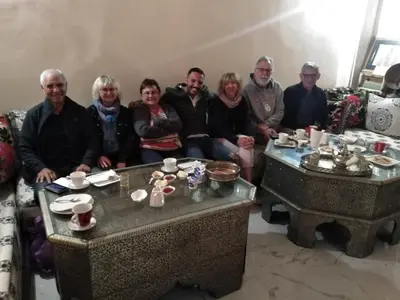 a group of people sitting in a living room at Riad Malak in Meknès
