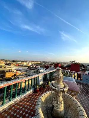 a view of a city from a balcony at Riad Malak in Meknès