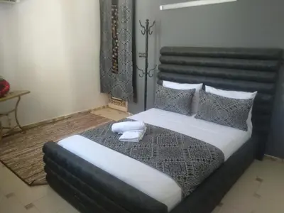 a bedroom with a large bed in a room at Riad Malak in Meknès