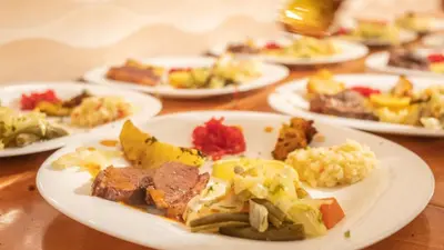 a table full of plates of food on a table at Riad Rihana Dades in Boumalne