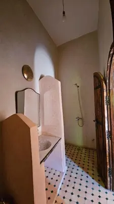 a bathroom with a toilet in the corner of a room at Dar M'hamid in Mhamid