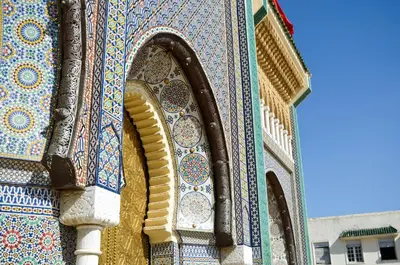 a building with colorful tiles on the side of it at Charming Riad Ouliya in Fs in Fès