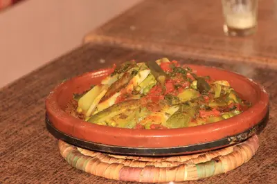 a bowl of food sitting on top of a table at les dunes D'or in Tagounite