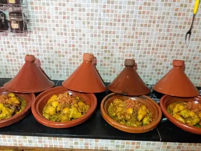 a group of four bowls of food on a counter at kasbah Dar Bahnini in Skoura