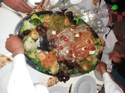a plate of food sitting on top of a table at kasbah Dar Bahnini in Skoura
