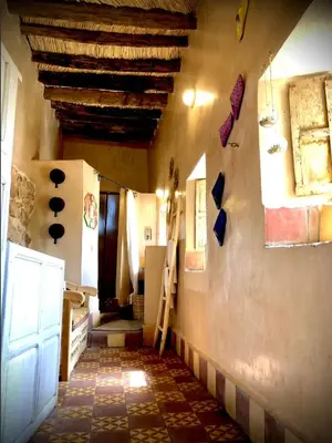 a hallway of a house with a tile floor at Maison d'hôte ''J'' in Agdz