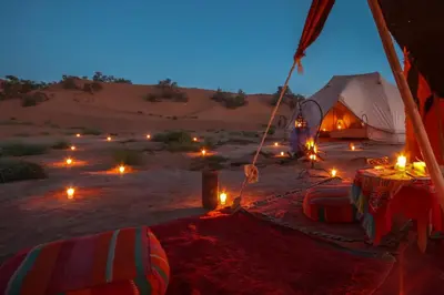 a tent in the middle of the desert at night at Exclusive 