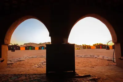 a view of two arched openings in a building at Rêve du Sahara - Dar Azawad Desert Camp in Mhamid