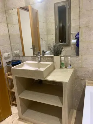 a bathroom with a sink and a mirror at Villa ChezMoi in Oulad Tayeb