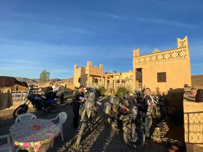 a group of motorcycles parked in front of a house at Auberge & Restaurant Agoudal in Agoudal