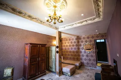 a room with a ceiling with a chandelier at Palais Shazam & SPA in Fès