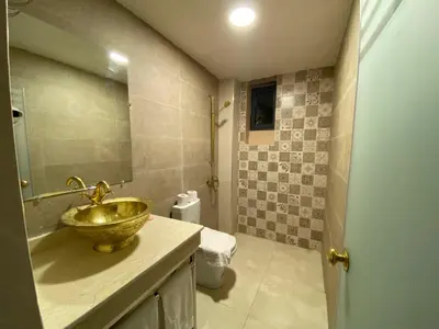 a bathroom with a bowl sink and a toilet at Palais Shazam & SPA in Fès