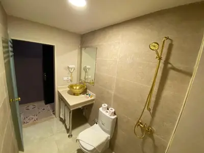 a bathroom with a toilet and a sink at Palais Shazam & SPA in Fès