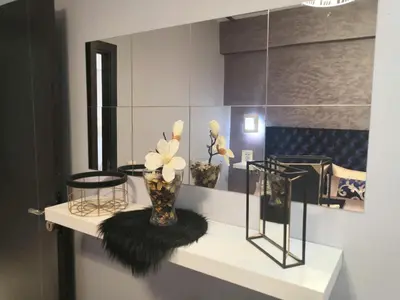 a room with vases and flowers on a shelf at Luxury apart in Fes monumental Exclusively for the family in Fès