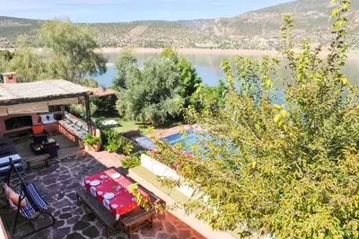 an aerial view of a resort with a lake at Villa sur le lac Bin el ouidane in Aït Irizane
