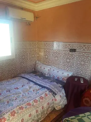 a small bedroom with a bed and a window at Hotel France Ouzoud in Ouzoud