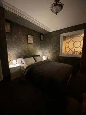 a bedroom with a bed and a window at Très joli appartement au centre de IFRANE in Ifrane